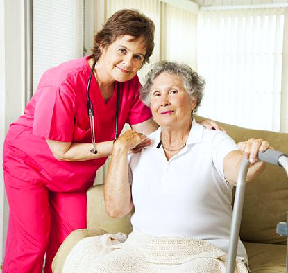 caregiver holding senior woman's shoulder