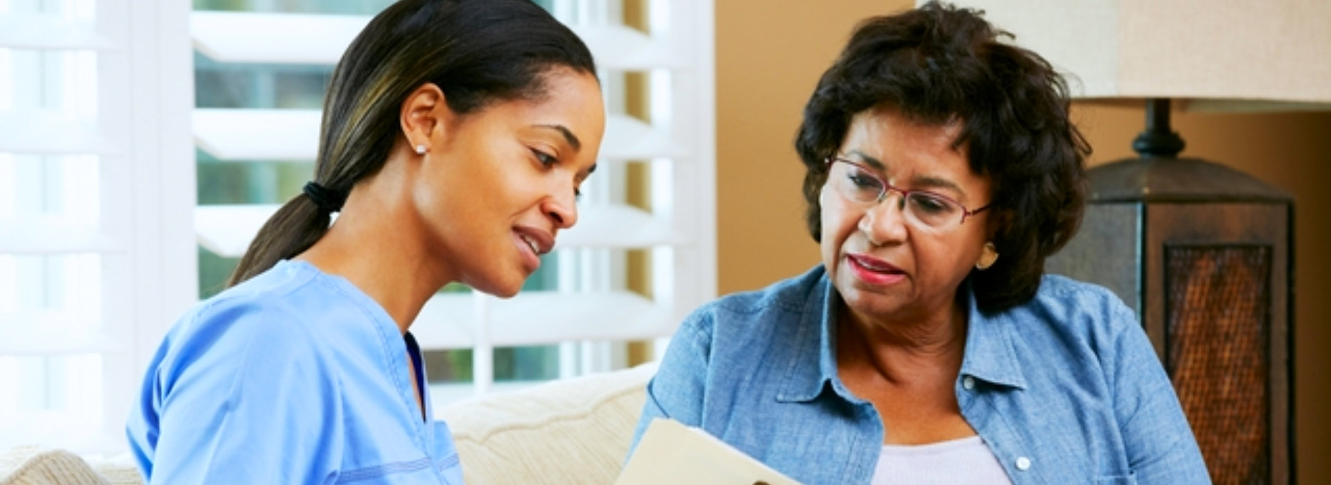 caregiver talking to senior woman
