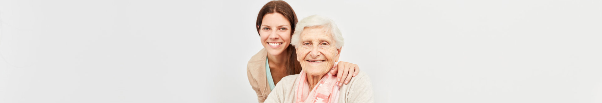 happy senior woman and caregiver